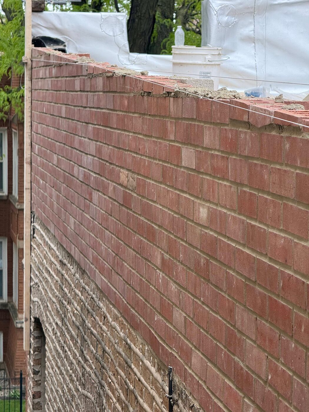 Repaired rooftop parapet wall